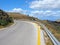 Mountain road, turning, yellow marking of roadside, metal fence