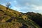 Mountain road way track in valley and snow peak. Morning, spring. Nepal landscape