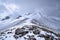 Mountain rocky landscape with stones and snow.