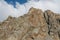 Mountain rocky wall of Tian Shan peaks in Tuyuk-Su