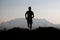 Mountain runner in silhouette in a suggestive landscape