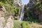 Mountain  Saar Falls with cold and crystal clear water descends from a crevice in the mountains of the Golan Heights in Israel