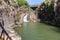 Mountain  Saar Falls with cold and crystal clear water descends from a crevice in the mountains of the Golan Heights in Israel