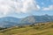 Mountain and savannah field with low cloud over hill. Rinjani mountain, Lombok island, Indonesia