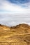 A mountain scene with clouds cover on a mountain hill. Cable see