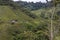 mountain scenery with an old farmhouse, woods and paddocks