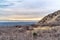 Mountain and sea with beautiful background of overcast sky and golden sunset