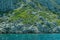 Mountain and sea. coastline with the overgrown rock