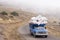 Mountain side road car passing through fogy road Gilan province