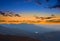 Mountain silhouette in a blue mist at the dramatic twilight