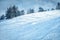 Mountain ski slope background on the skiing resort. Active winter holiday. European ski resort in alpine mountains.