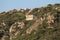 Mountain slope at sunset, ruins. Baja Sardinia