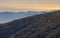 Mountain slopes, blue mountains and the sea