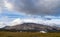 Mountain of Snaefellsjokull National Park with white cloudy cap on peak. Iceland