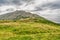 Mountain Snezka on summer cloudy day