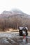 Mountain with snow and fog on the top, trees and guard house below at carpark of Noboribetsu Bear Park in Hokkaido, Japan