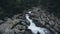 Mountain spring stream small waterfall in forest