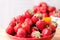 Mountain strawberry red plate, on a background of strawberries,