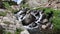 Mountain Stream Cascading Through Boulders