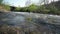 Mountain Stream Flowing Down From Hill To Valley