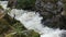 Mountain stream flowing quickly after rainfall in the Highlands of Scotland