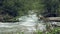 Mountain stream with rapids. Misty mysterious brook