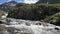 Mountain stream in Switzerland alps in slow motion.