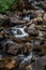 Mountain stream waterfall over rocks