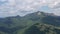 Mountain summer scene, flying drone above the forest