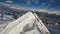 Mountain sunny landscape stone ridge slope cinematic ski resort alpine environment aerial view