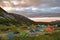 Mountain at sunrise with camping panoramic view