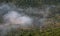 Mountain tops covered in a layer of mist and fog at dawn. Nature landscape