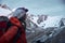 mountain tourist looking at a glacier peaks