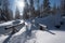 Mountain trail covered with snow and large snowdrifts