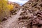 Mountain trail in the rocks. Mountain road with stones.