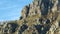 Mountain trail on rocky slope under blue sky. Shot. Wonderful view on European rocks