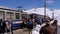 Mountain Train with Tourists at the Top Train Station near Snowy Mountain Rochers-de-Naye, Montreux, Switzerland