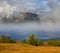 mountain valley in dense mist