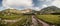 Mountain valley full of Wahlenbergovo lake and blooming flowers and a sidewalk leading to the valley. High Tatras national park ,