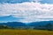 Mountain valley with horses, golden autumn panorama landscape, view of the Beluha in sunny weather, Altai Republic, Russia