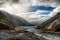 Mountain valley with the river. New Zealand. One can see rain on the left hand side of the breathtaking image. New Zealand south