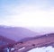 Mountain valley in a snow at the early morning