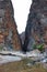 Mountain and valley view along Wadi Sahtan road and snake canyon in Al Hajir mountains between Nizwa and Mascat in Oman