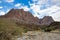 Mountain and valley view along Wadi Sahtan road and snake canyon in Al Hajir mountains between Nizwa and Mascat in Oman