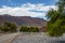 Mountain and valley view along Wadi Sahtan road and snake canyon in Al Hajir mountains between Nizwa and Mascat in Oman