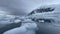 Mountain view in Antartica with reflection in water