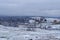 Mountain view covered with snow under a blue sky with white clouds