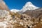 Mountain View of high snow capped Peak and Backpacker walking