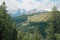 Mountain view, peaks in the clouds and forest