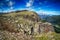 Mountain view with rocky surface and blue sky